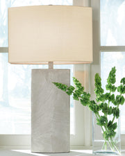 Ashley Furniture Bradard Lamp Set with two table lamps featuring neutral fabric shades and dark wood bases.