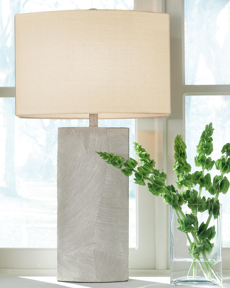 Ashley Furniture Bradard Lamp Set with two table lamps featuring neutral fabric shades and dark wood bases.