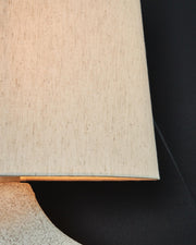 Pair of Ashley Furniture Chadrich table lamps with beige fabric shades and wood bases, perfect for bedside or living room decor.