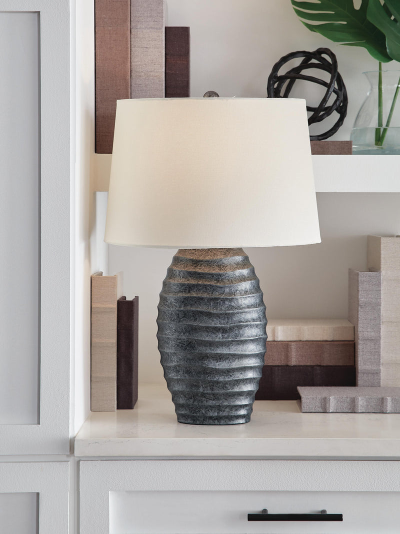 Pair of Ashley Furniture Caronick table lamps with fabric shades and wooden bases, ideal for living room or bedside decor.