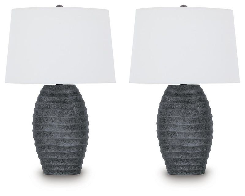 Pair of Ashley Furniture Caronick table lamps with beige fabric shades and wooden bases, ideal for bedside or living room decor.