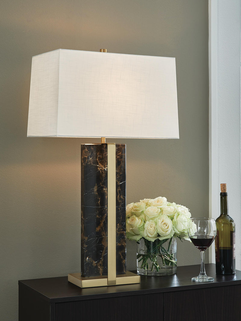 Neonish table lamp by Ashley Furniture with a modern design, featuring a sleek base and a vibrant, illuminated shade.