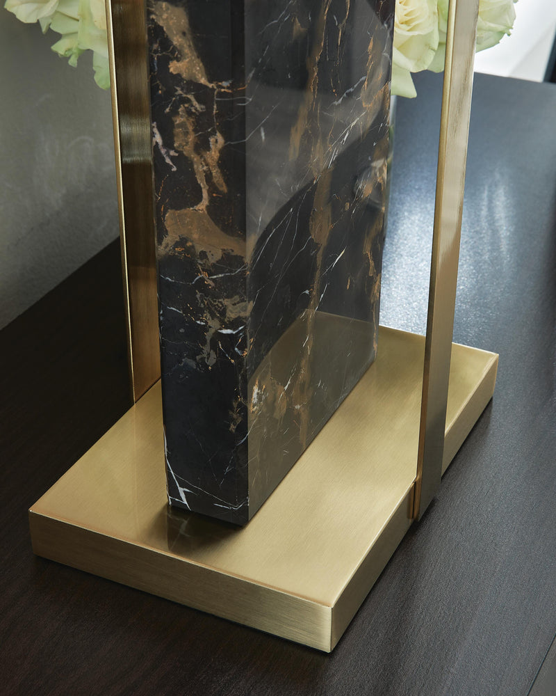 Ashley Furniture Neonish table lamp with modern design, featuring a sleek base and vibrant neon-colored shade on a wooden table.