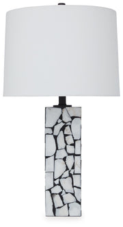 Ashley Furniture Macaria table lamp with a sleek design and fabric shade, perfect for enhancing home decor.
