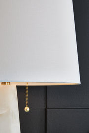Ashley Furniture Laurellen table lamp set featuring detailed fabric shades and elegant design for stylish home lighting.