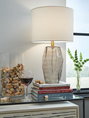 Ashley Furniture Taylow lamp set featuring two modern table lamps with beige shades and dark wood bases.