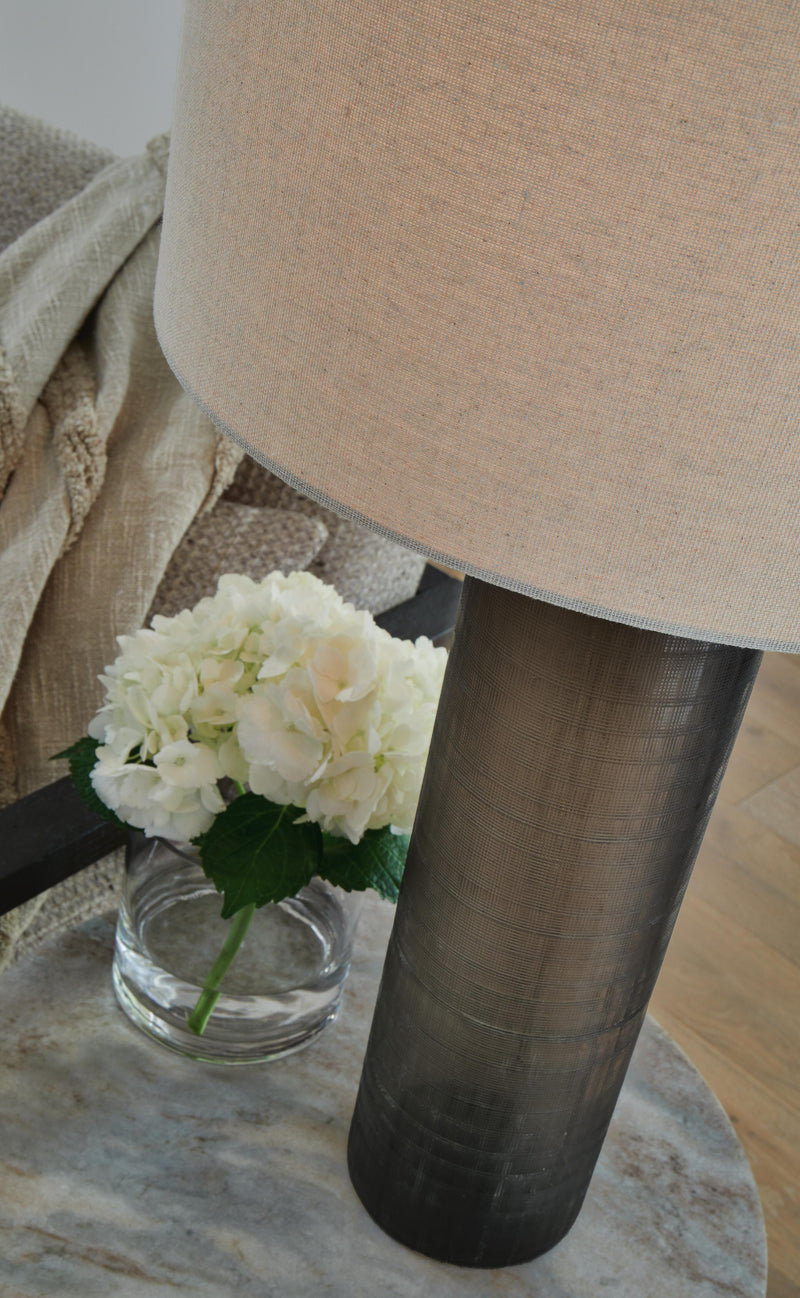 Ashley Furniture Dingerly table lamp set with matching ceramic bases and fabric shades, featuring a modern design.