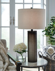 Ashley Furniture Dingerly table lamp set with two modern lamps featuring fabric shades and wooden bases.