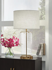 Ashley Furniture Gizeh Table Lamp with a sleek base and fabric shade, perfect for adding style and lighting to a living space.