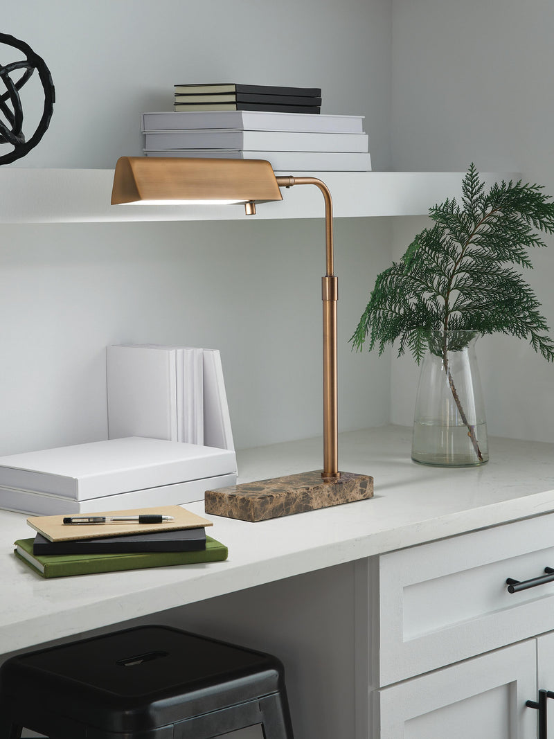 Ashley Furniture Yafe desk lamp, table lamp with modern design and white shade, on a wooden desk.