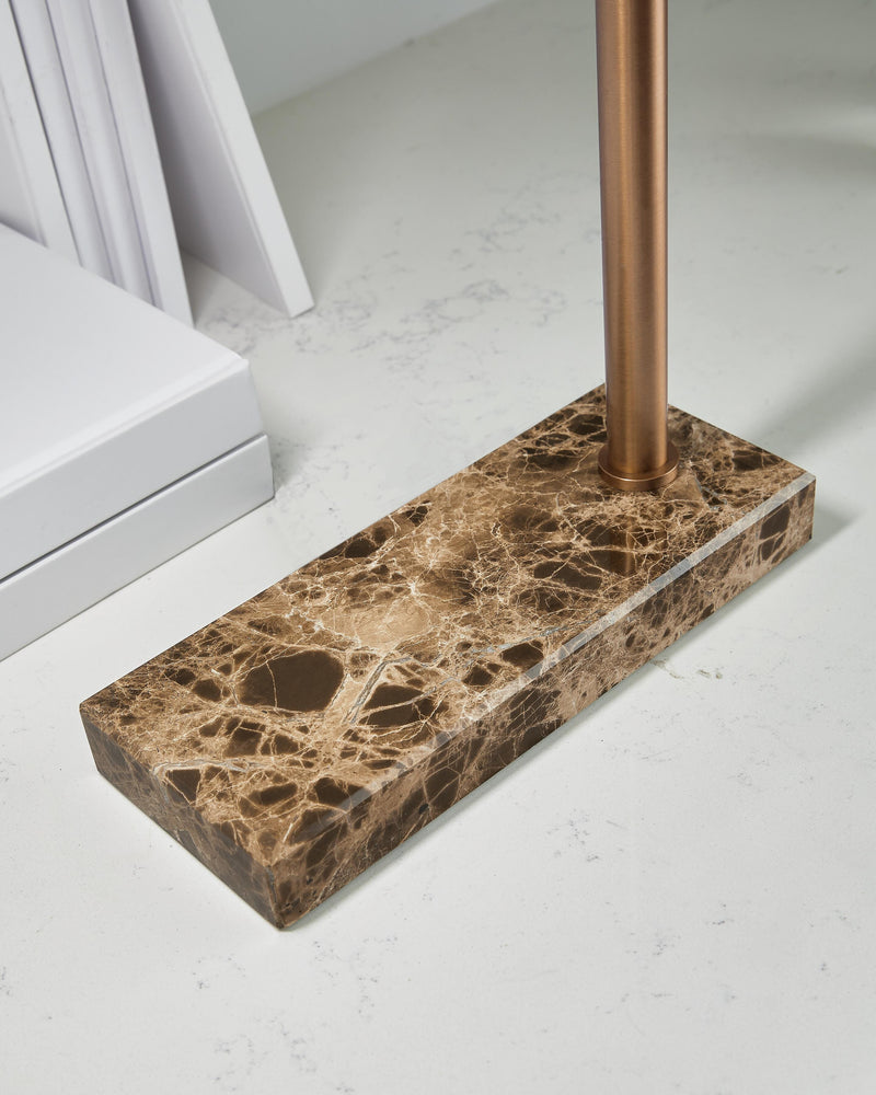 Close-up of the base of a Yafe Ashley Furniture table desk lamp with a modern design and sleek finish.