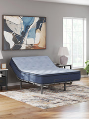 Ashley Furniture Peak 2.0 12 Hybrid Mattress showing plush top surface and supportive base in a bedroom setting