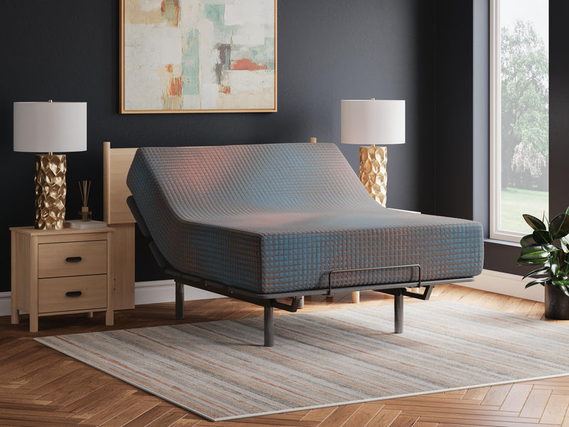 13-inch hybrid mattress by Ashley Furniture with plush fabric cover and layered foam and coil support system.
