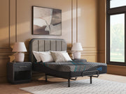 Ashley Furniture Millennium 2.0 Hybrid 14-inch innerspring mattress with plush fabric and supportive layers, shown on a bed frame.
