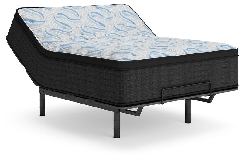 Ashley Furniture Elite Springs Plush innerspring mattress with a raised angle view showing soft, plush surface and supportive construction.