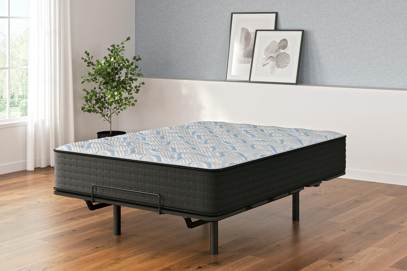 Ashley Furniture Elite Springs Plush Innerspring Mattress with quilted top and supportive coils, designed for comfort and durability.