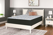 Ashley Furniture Elite Springs Plush Innerspring Mattress with quilted top and supportive coil system, shown in a bedroom setting.