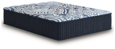 Ashley Furniture Firm Luxe 2.0 innerspring mattress shown from an angle, showcasing plush surface and supportive structure.