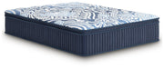 Ashley Furniture Plush Luxe 2.0 innerspring mattress shown from an angle with plush surface and supportive construction.