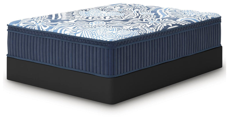 Ashley Furniture Plush Luxe 2.0 innerspring mattress shown from an angled side view with plush surface and supportive design.