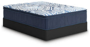 Ashley Furniture Plush Luxe 2.0 innerspring mattress shown from an angle, featuring plush surface and supportive coil construction.