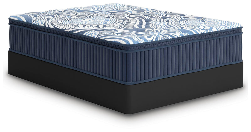 Ashley Furniture Plush Luxe 2.0 innerspring mattress shown from an angle, featuring plush surface and supportive coil construction.