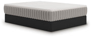 Ashley Furniture Terra Sleep Firm hybrid mattress shown from an angle, featuring a plush, supportive surface with detailed stitching.