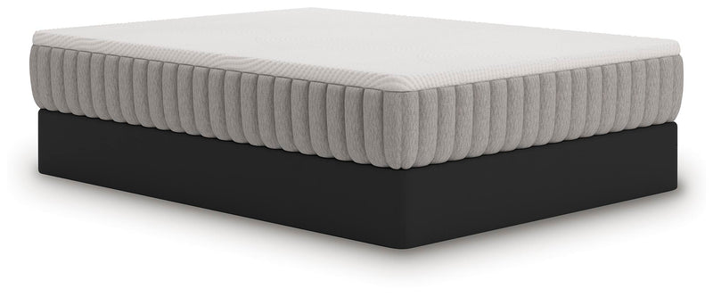Ashley Furniture Terra Sleep Firm hybrid mattress shown from an angle, featuring a plush, supportive surface with detailed stitching.