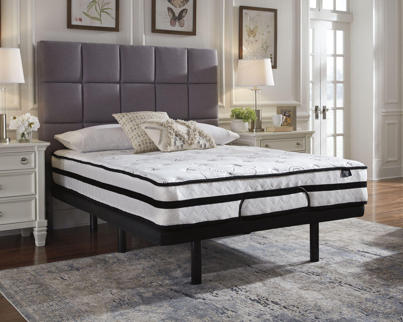 Ashley Furniture Chime 10-inch hybrid mattress in a box, showing plush surface with stitched detailing and supportive layers.