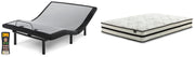 Ashley Furniture Chime 10-inch hybrid mattress set with supportive layers and plush surface, shown in a bedroom setting.