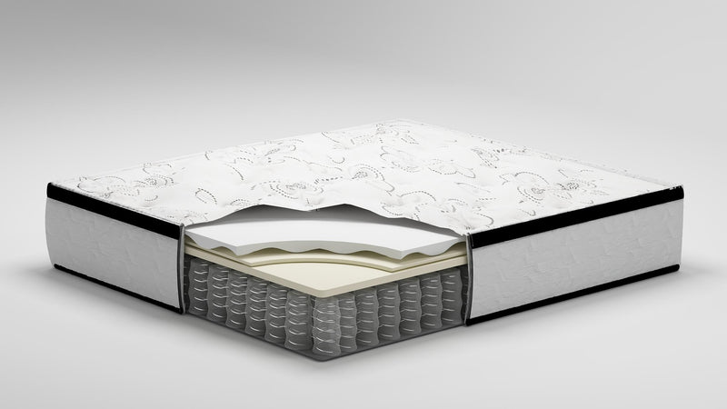 Ashley Furniture Chime 12-inch hybrid mattress in a box with layered foam and coil construction, ready for easy setup.