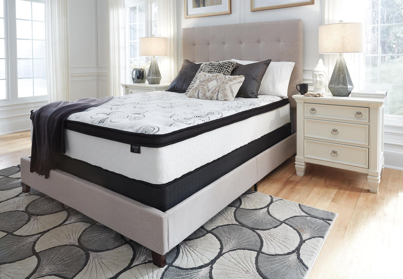 Ashley Furniture Chime 12-inch hybrid mattress in a box, showcasing its plush fabric cover and hybrid design for comfort and support.