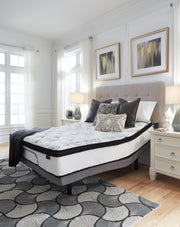 Ashley Furniture Chime 12-inch hybrid mattress in a box, showcasing soft fabric cover and supportive layers for comfortable sleep.