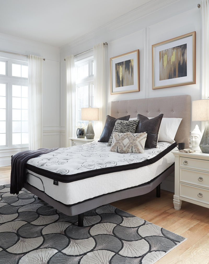 Ashley Furniture Chime 12-inch hybrid mattress in a box, showcasing soft fabric cover and supportive layers for comfortable sleep.