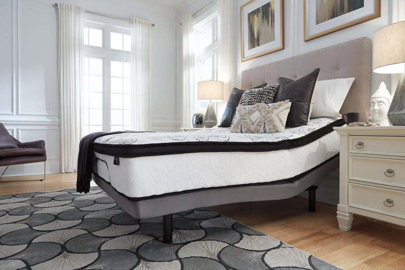 Ashley Furniture Chime 12-inch hybrid mattress in a box, showing the plush surface with quilted top and supportive layers.