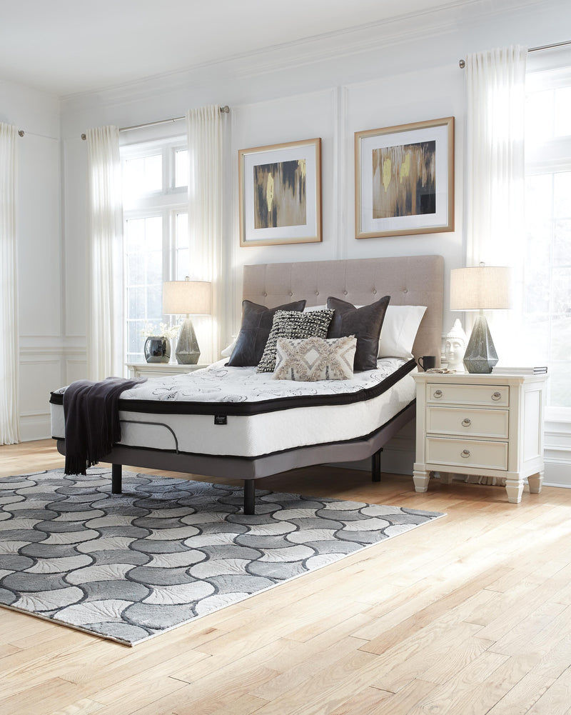 Ashley Furniture Chime 12-inch hybrid mattress in a box, showcasing plush fabric and supportive design for comfortable sleep.
