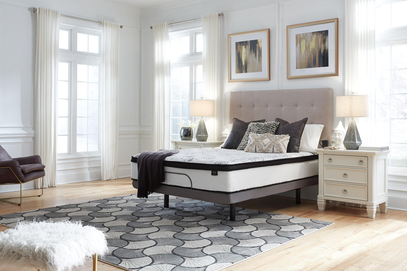 Ashley Furniture Chime 12-inch hybrid mattress in a box, showing plush surface with quilted top and supportive layers.