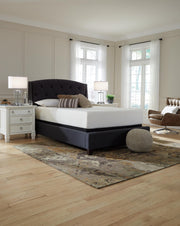 Ashley Furniture Chime 12-inch memory foam mattress in a box, showcasing the plush, supportive surface and neatly rolled design.