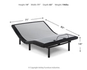 Ashley Furniture Chime 10-inch hybrid mattress set with head and foot sections, shown with plush bedding and pillows.