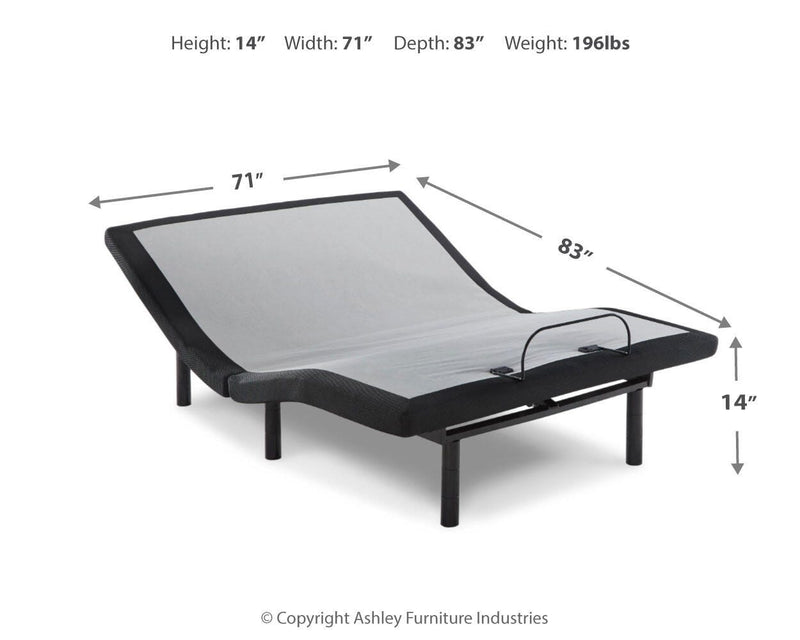Ashley Furniture Chime 10-inch hybrid mattress set with head and foot sections, shown with plush bedding and pillows.