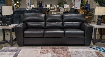 Ashley Furniture Glennbre sofa with plush cushions and neutral fabric, featuring a modern design for comfortable living rooms.