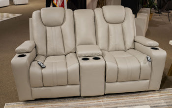 Ashley Furniture Elevate Edges Glider Reclining Loveseat with console, featuring plush cushions and built-in cup holders.