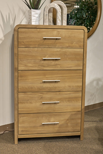 Ashley Furniture Gramburg chest of drawers with a classic wood finish and multiple spacious drawers for bedroom storage.