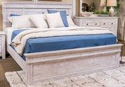 Ashley Furniture Makidern Bed with upholstered headboard and wooden frame, shown in a modern bedroom setting.