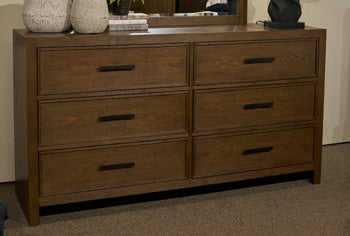 Ashley Furniture Dacylyn dresser with matching mirror, showcasing a sleek wooden finish and elegant storage drawers.