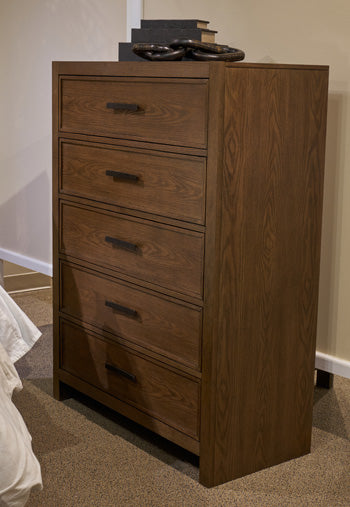 Ashley Furniture Dacylyn chest of drawers with four spacious drawers and a warm wood finish.