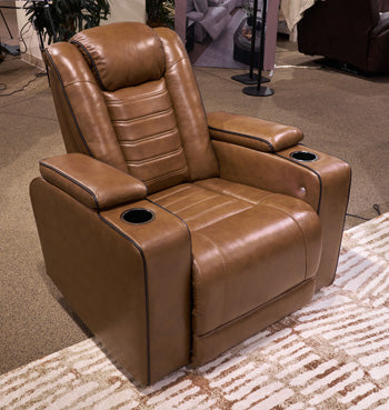Ashley Furniture Gruaro Power Recliner with plush upholstery and modern design, showcasing its comfortable seating and built-in recline feature.