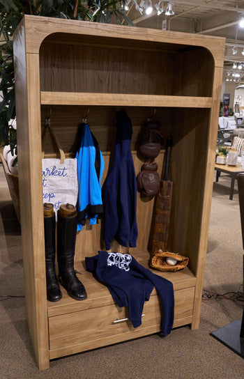 Ashley Furniture Dovander hall tree with storage bench, featuring coat hooks, a cushioned seat, and organized storage space.