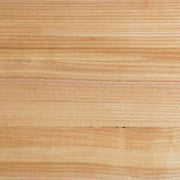 Swatch of Ashley Furniture Kinlanni bedroom set in natural wood finish, showcasing the wood grain and elegant bedroom furniture style.