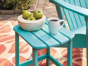 Ashley Furniture Sundown Treasure outdoor table set with a round table and matching chairs, ideal for patio seating.